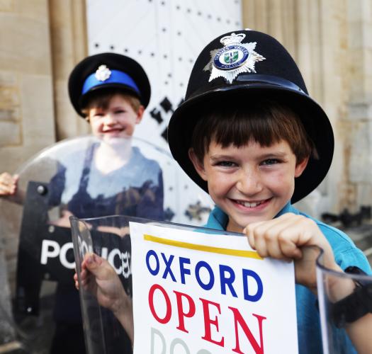 Two small boys in police hats