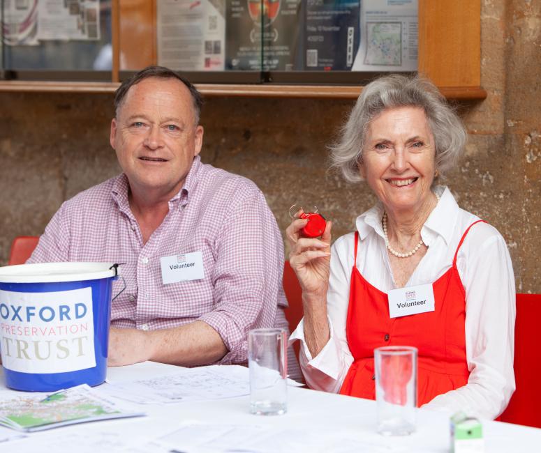 Volunteers during Oxford Open Doors, with donation bucket and clicker