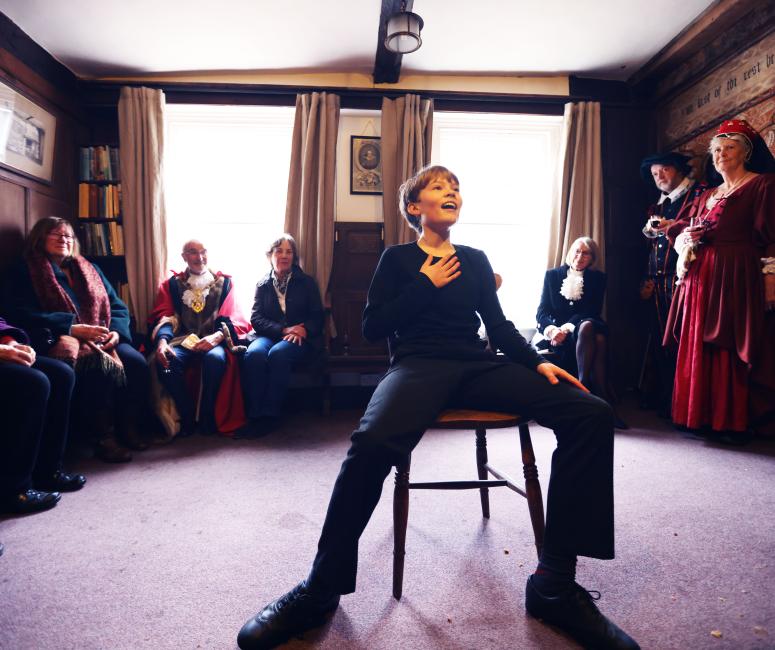Boy performing in Shakespeare's painted Room